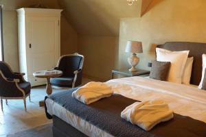Postel nebo postele na pokoji v ubytování Boutique Hotel De Brakelhoen