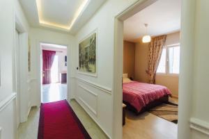 Postel nebo postele na pokoji v ubytování Vila Ada Hotel