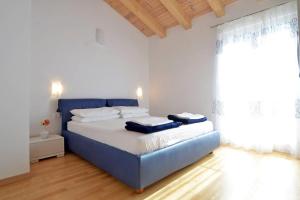 Łóżko lub łóżka w pokoju w obiekcie Villa Blue 2