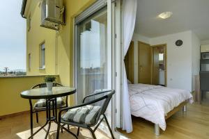 Postel nebo postele na pokoji v ubytování Apartments Kralj