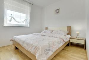 Postel nebo postele na pokoji v ubytování Apartments Kralj