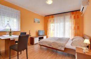 TV a/nebo společenská místnost v ubytování Apartments Kralj
