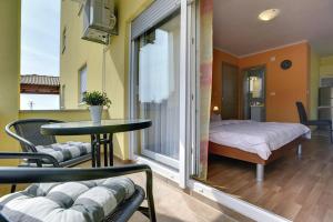 Postel nebo postele na pokoji v ubytování Apartments Kralj