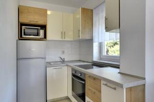 Kuchyň nebo kuchyňský kout v ubytování Apartments Kralj