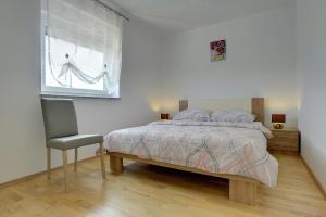 Postel nebo postele na pokoji v ubytování Apartments Kralj