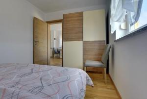 Postel nebo postele na pokoji v ubytování Apartments Kralj