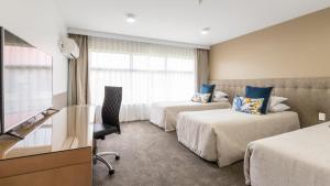 เตียงในห้องที่ Distinction Hamilton Hotel & Conference Centre