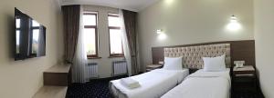 Postel nebo postele na pokoji v ubytování Hotel Khanaka