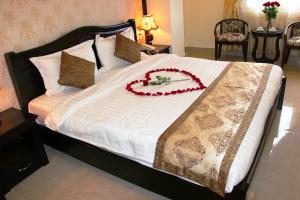 Letto o letti in una camera di Royal Dalat Hotel