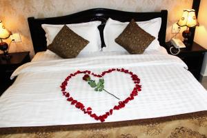 Letto o letti in una camera di Royal Dalat Hotel