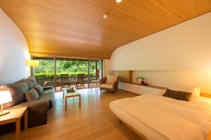 a bedroom with a bed and a living room at Fujiiso in Takayama +83 photos
