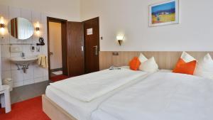 Postel nebo postele na pokoji v ubytování City Partner Hotel Berliner Hof