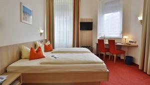 Postel nebo postele na pokoji v ubytování City Partner Hotel Berliner Hof