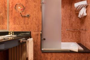 a bathroom with a shower and a sink at Eurostars Las Claras in Salamanca