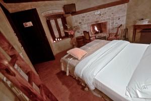 Postel nebo postele na pokoji v ubytování Robur Marsorum Albergo Diffuso