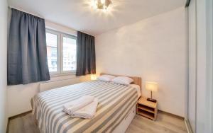 Posteľ alebo postele v izbe v ubytovaní Funkcjonalne i Komfortowe Apartamenty Sun Seasons 24 w Kołobrzegu by Noclegi Renters