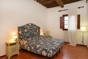 Postel nebo postele na pokoji v ubytování Agriturismo Tenuta Vallelunga