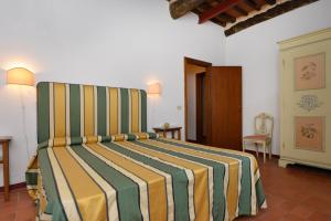 Postel nebo postele na pokoji v ubytování Agriturismo Tenuta Vallelunga