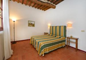 Postel nebo postele na pokoji v ubytování Agriturismo Tenuta Vallelunga