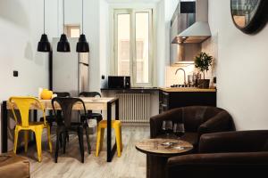 A seating area at BMGA l Stylish Industrial Termini Apartment