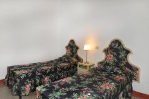 Postel nebo postele na pokoji v ubytování Agriturismo Tenuta Vallelunga