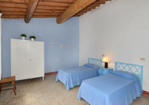 Postel nebo postele na pokoji v ubytování Agriturismo Tenuta Vallelunga