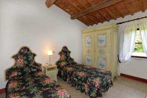 Postel nebo postele na pokoji v ubytování Agriturismo Tenuta Vallelunga