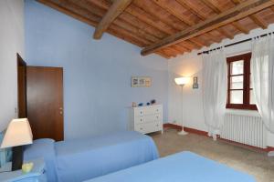 Postel nebo postele na pokoji v ubytování Agriturismo Tenuta Vallelunga