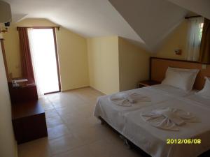 Postel nebo postele na pokoji v ubytování Felice Hotel