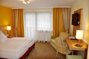 Postel nebo postele na pokoji v ubytování Gasthof Landhotel Hubmann