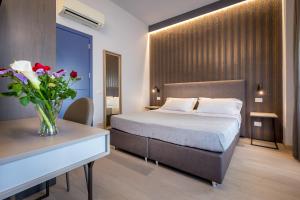 A bed or beds in a room at Blu Notte Guest House
