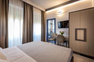 A bed or beds in a room at Blu Notte Guest House