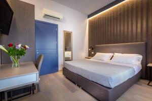 A bed or beds in a room at Blu Notte Guest House