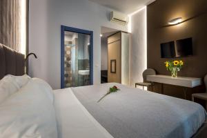 A bed or beds in a room at Blu Notte Guest House