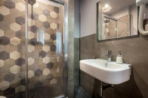 a bathroom with a sink and a shower at Blu Notte Guest House in Florence