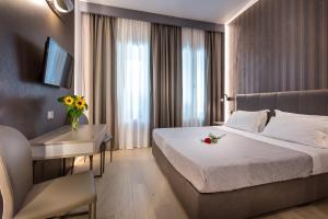 A bed or beds in a room at Blu Notte Guest House