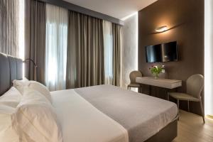 A bed or beds in a room at Blu Notte Guest House