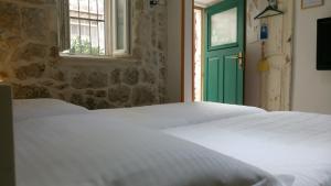 Postel nebo postele na pokoji v ubytování Apartment Dubrovnik Center