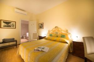 Posteľ alebo postele v izbe v ubytovaní Locanda Orchidea