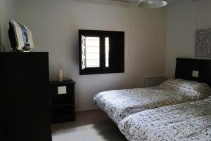 سرير أو أسرّة في غرفة في Casas Rurales Villa Sem Sem