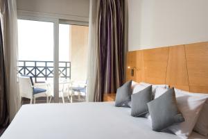 Porto El Jabal Hotel tesisinde bir odada yatak veya yataklar