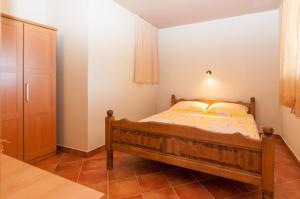 En eller flere senge i et værelse på Apartment Mihaljinec