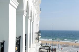 a view of the beach from the balcony of a building at Gran Hotel Sardinero in Santander