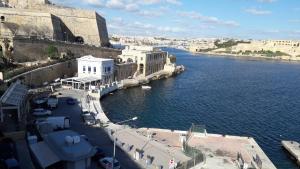 a view of a river with buildings and a city at Valletta Mint Apartment 1 in Valletta