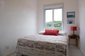 Ένα ή περισσότερα κρεβάτια σε δωμάτιο στο Sea Front, Front Native Forest