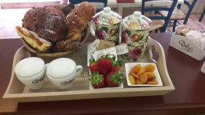 a tray with bread and fruit on a table at Almayer La Locanda in Gaeta