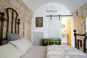 Un pat sau paturi într-o cameră la Torlevigne Relax & Pool