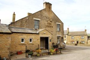 an old brick building with a sign on it at Micro Barn Mickleton Barnard Castle in Mickleton