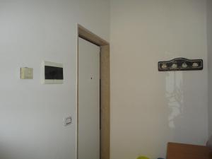 a room with a door and a sign on the wall at Travel and Living in Trani
