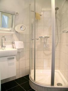 a bathroom with a shower and a sink at Natursteinvilla am Goldberg in Hagen +33 photos